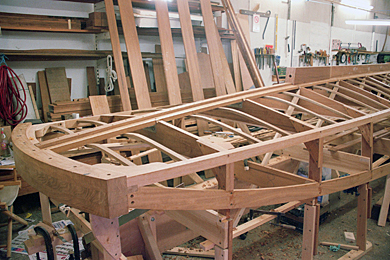 Wooden slipper hull frame in workshop
